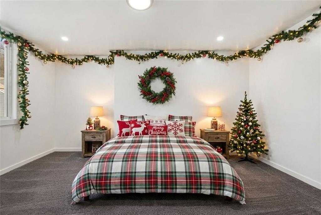 1619 Haug Street Pittsburgh, PA 15212 - Photo 12 of 27 a bedroom with bed and a chandelier