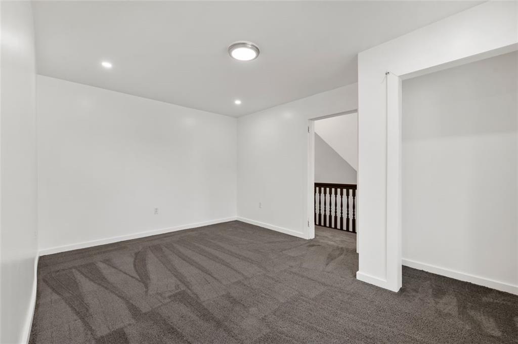 1619 Haug Street Pittsburgh, PA 15212 - Photo 21 of 27 an empty room with wooden floor and windows