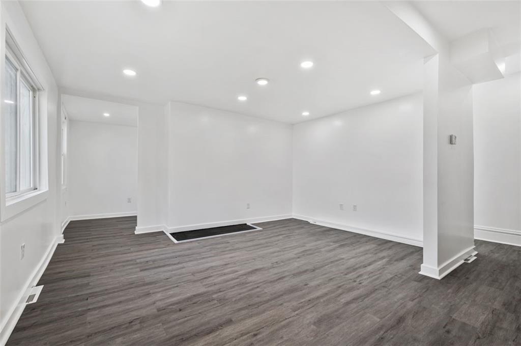 1619 Haug Street Pittsburgh, PA 15212 - Photo 3 of 27 a view of an empty room with wooden floor