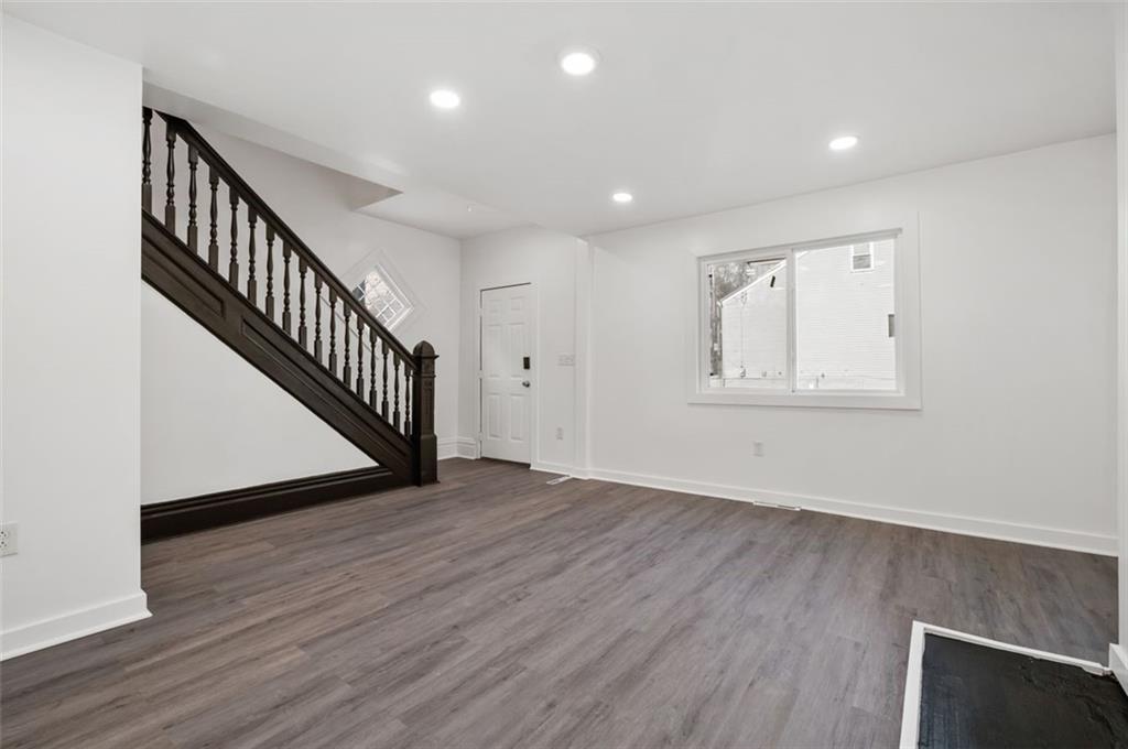 1619 Haug Street Pittsburgh, PA 15212 - Photo 5 of 27 wooden floor in an empty room with a window