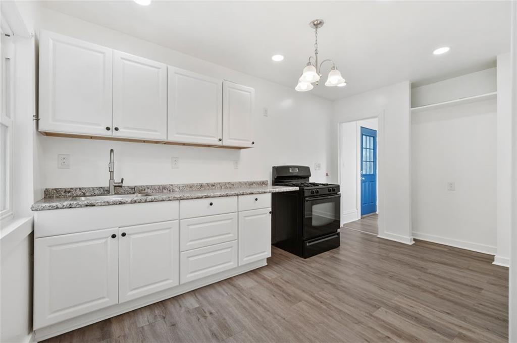 1619 Haug Street Pittsburgh, PA 15212 - Photo 7 of 27 a kitchen with granite countertop white cabinets and stainless steel appliances