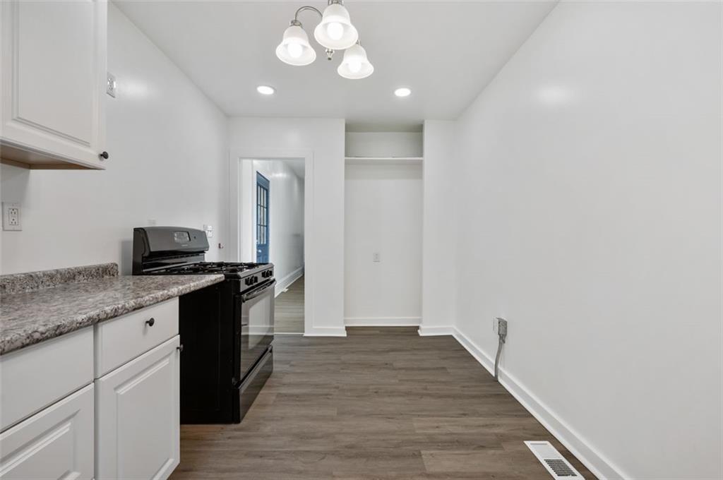 1619 Haug Street Pittsburgh, PA 15212 - Photo 8 of 27 a kitchen with granite countertop cabinets a sink and stainless steel appliances