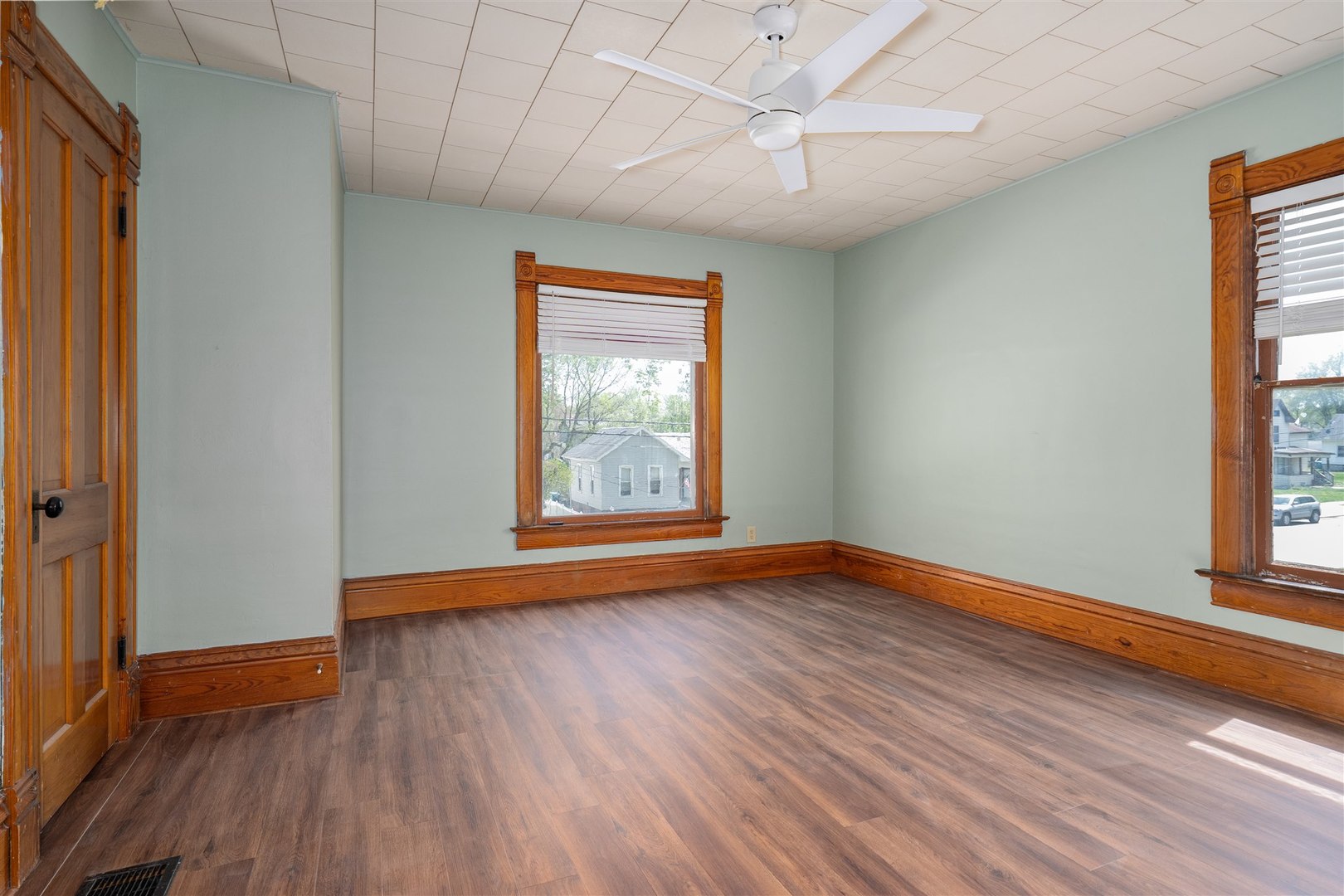 765 North Main Street Pontiac, IL 61764 - Photo 12 of 30 an empty room with wooden floor and windows