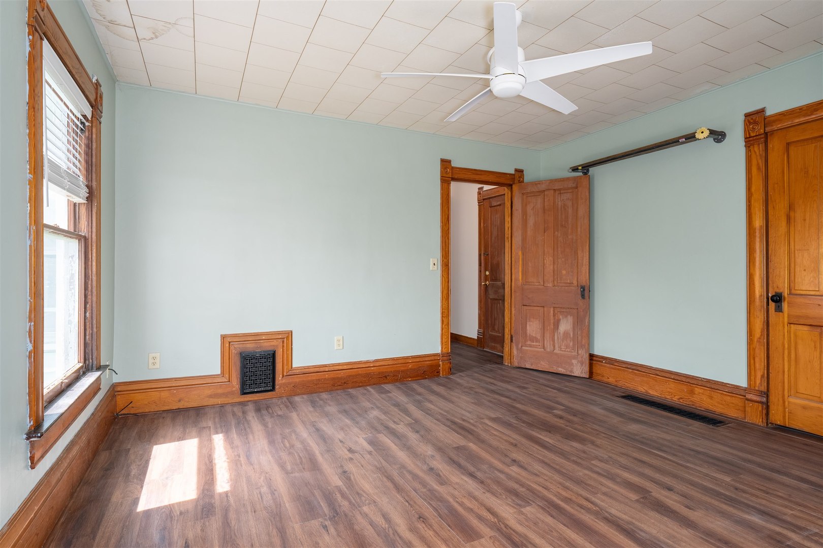 765 North Main Street Pontiac, IL 61764 - Photo 14 of 30 a view of empty room with wooden floor and fan