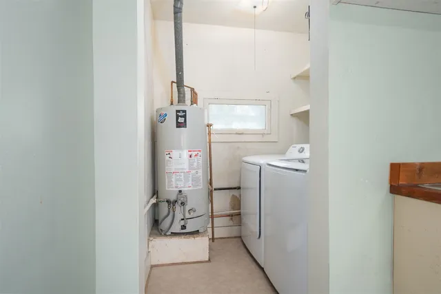 a bathroom with a sink and washing machine