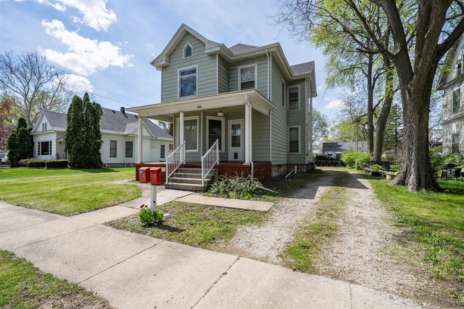 765 North Main Street Pontiac, IL 61764 - Photo 24 of 30 a front view of house with yard and green space