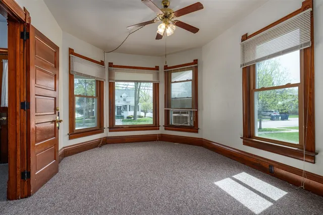 a view of an empty room with a window
