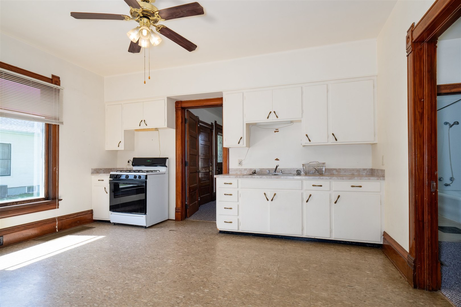 765 North Main Street Pontiac, IL 61764 - Photo 5 of 30 a kitchen with cabinets stainless steel appliances and a window