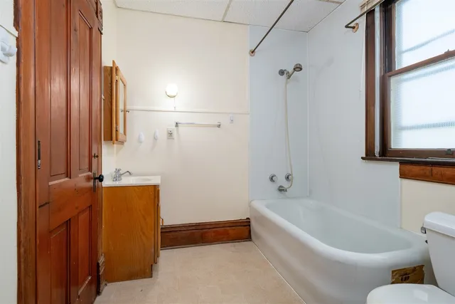 a bathroom with a bathtub and shower