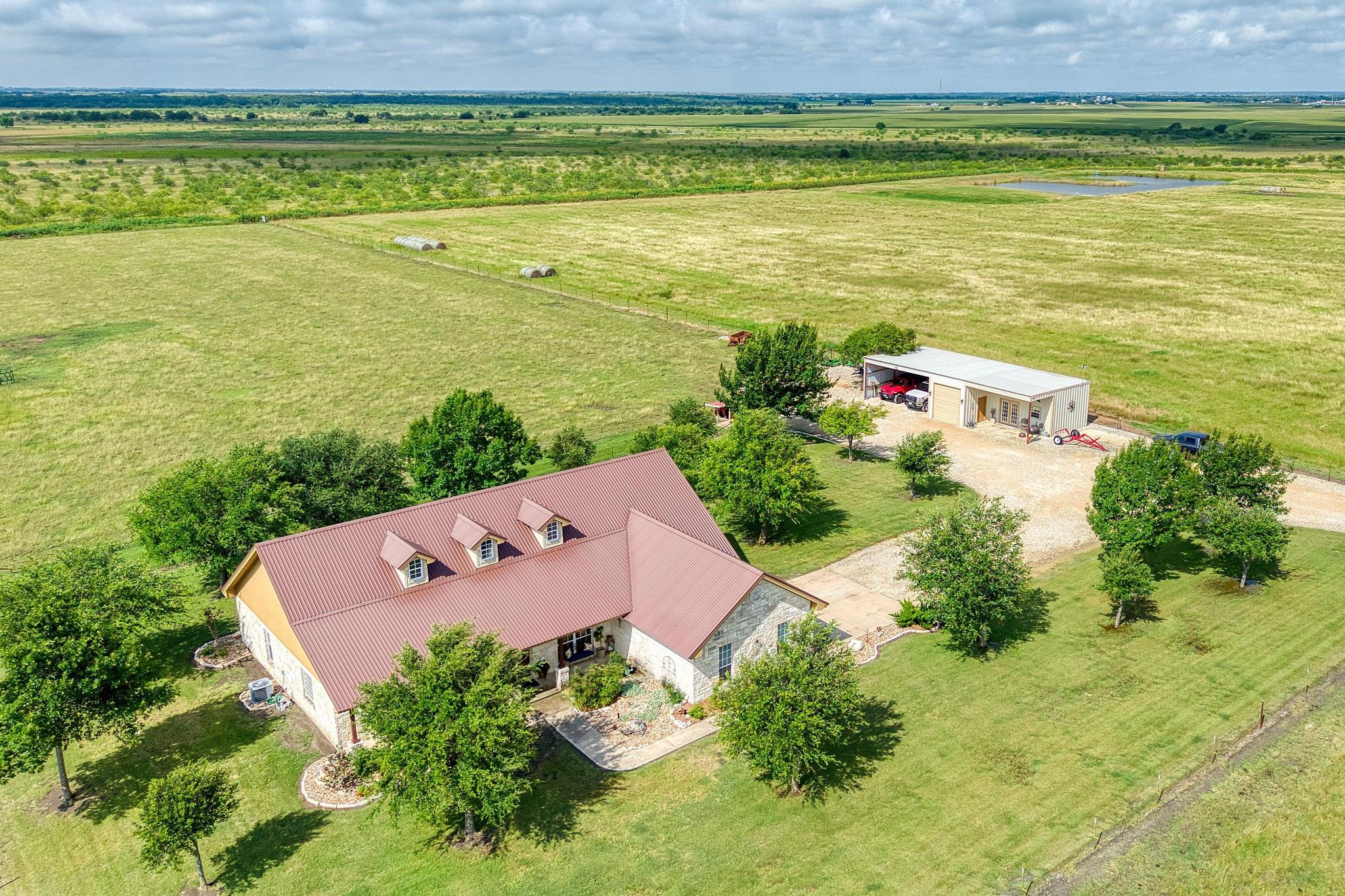 19000 Farm To Market Road 971 Granger, TX 76530 - Photo 4 of 40 The property features a charming single-story home.