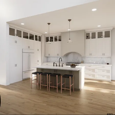 a kitchen with kitchen island granite countertop a sink a stove and a wooden floors