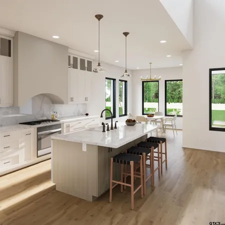 a view of a kitchen with washer and dryer