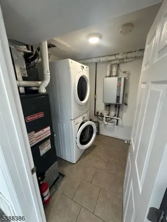 a utility room with sink dryer and washer