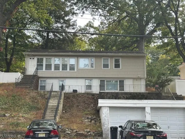 a front view of a house with parking