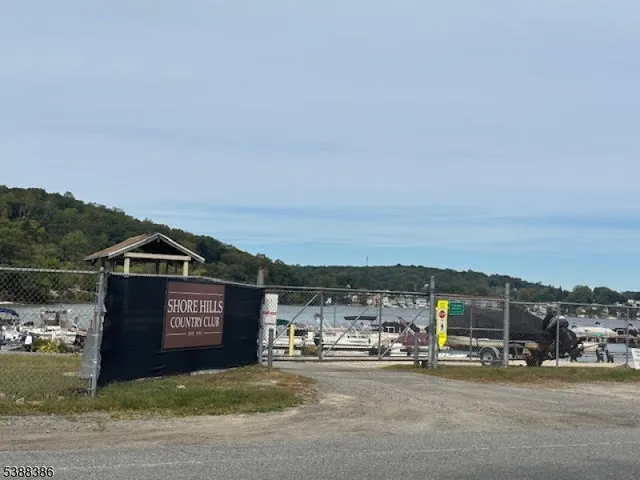 a view of a street with a car parked on the side of road