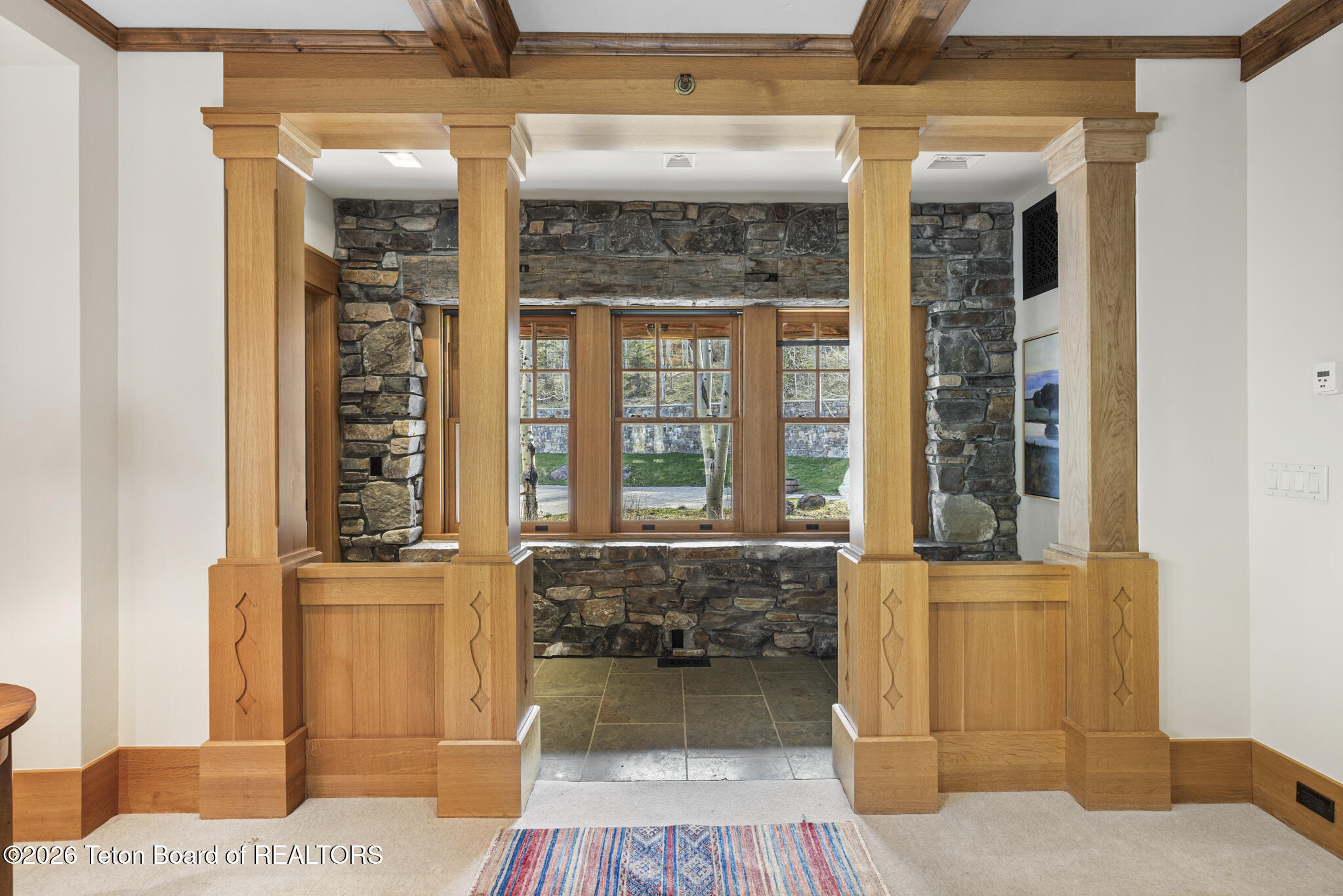 14925 South McCoy Road Jackson, WY 83001 - Photo 27 of 64 Garage Hallway to TV Room