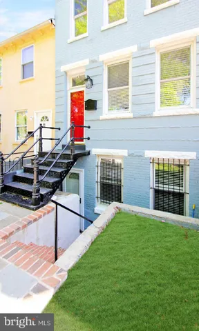a view of swimming pool with seating space