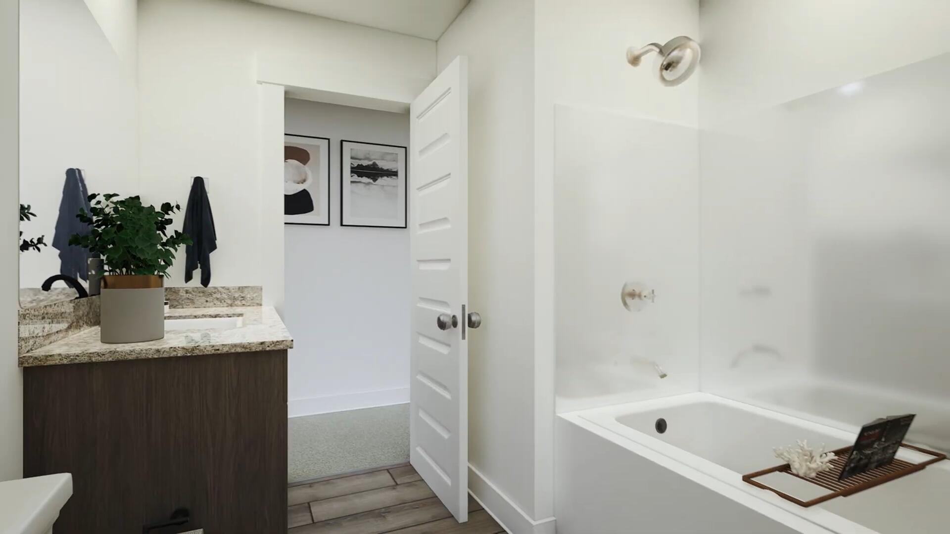 350 Bluebeech Street Freeport, FL 32439 - Photo 21 of 42 a bathroom with a granite countertop sink a mirror a bathtub and shower