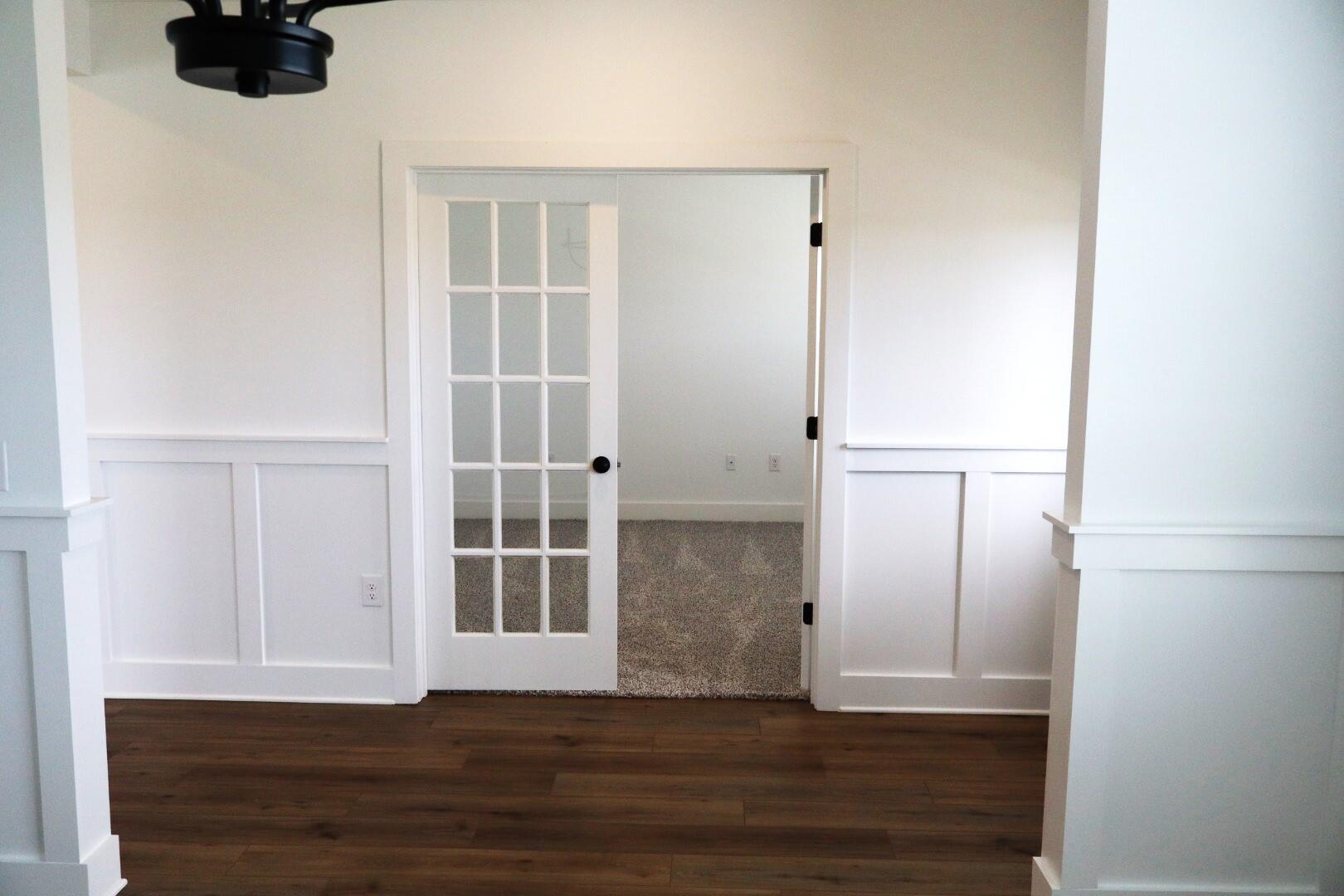 350 Bluebeech Street Freeport, FL 32439 - Photo 34 of 42 an empty room with wooden floor and windows