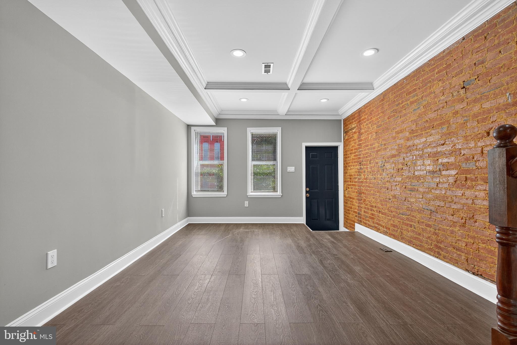 320 South Pulaski Street Baltimore, MD 21223 - Photo 11 of 46 wooden floor in an empty room with a window