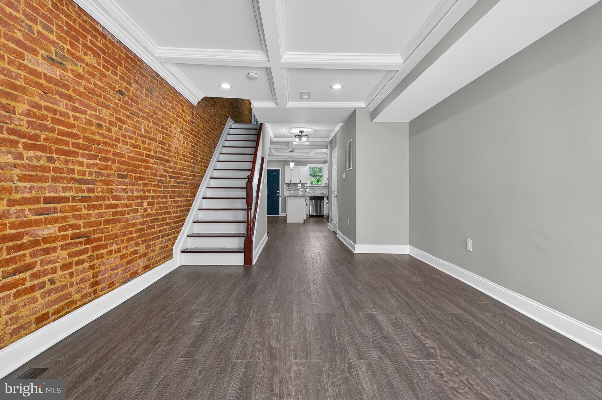 320 South Pulaski Street Baltimore, MD 21223 - Photo 13 of 46 a view of a hallway with wooden floor