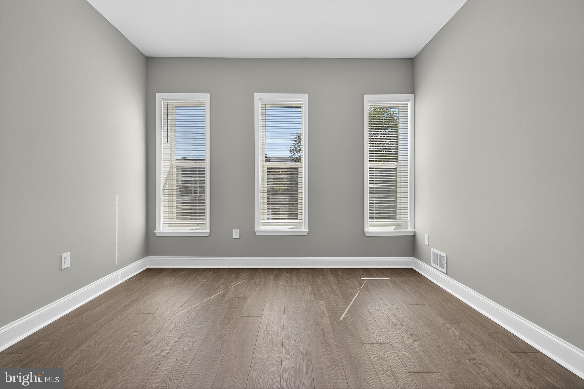 320 South Pulaski Street Baltimore, MD 21223 - Photo 18 of 46 a view of wooden floor and windows in a room