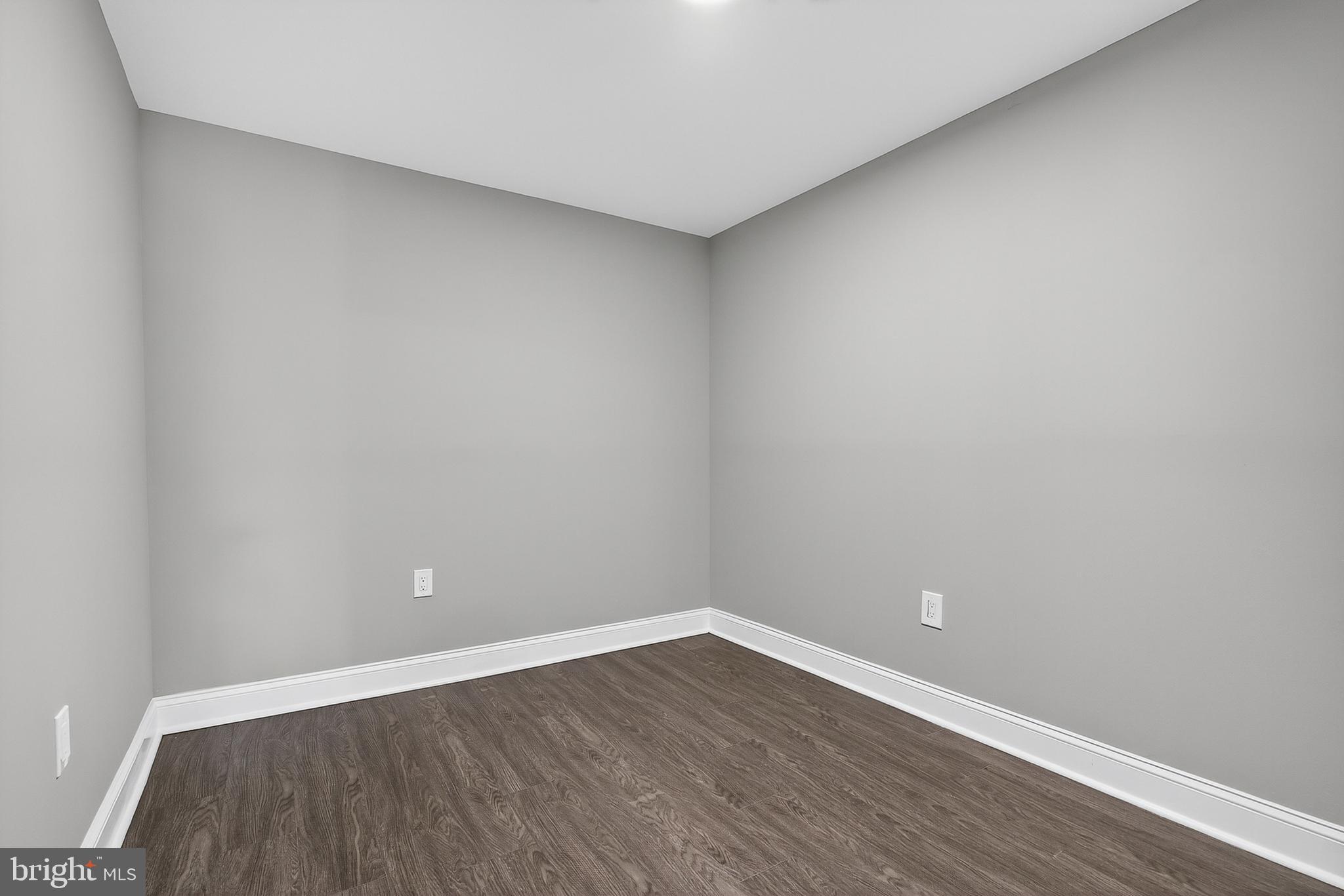 320 South Pulaski Street Baltimore, MD 21223 - Photo 34 of 46 a view of an empty room with wooden floor