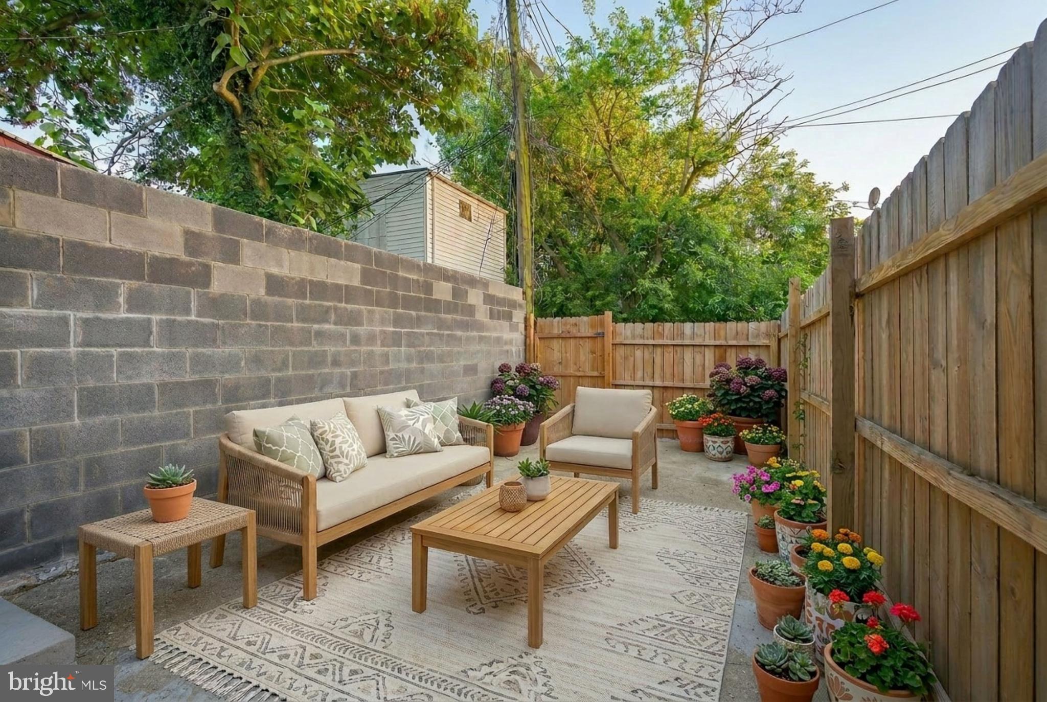 320 South Pulaski Street Baltimore, MD 21223 - Photo 46 of 46 a view of a patio with couches and potted plants