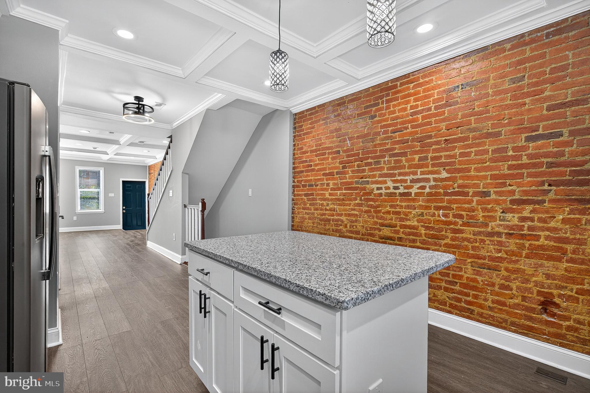 320 South Pulaski Street Baltimore, MD 21223 - Photo 5 of 46 a view of kitchen with cabinets and wooden floor