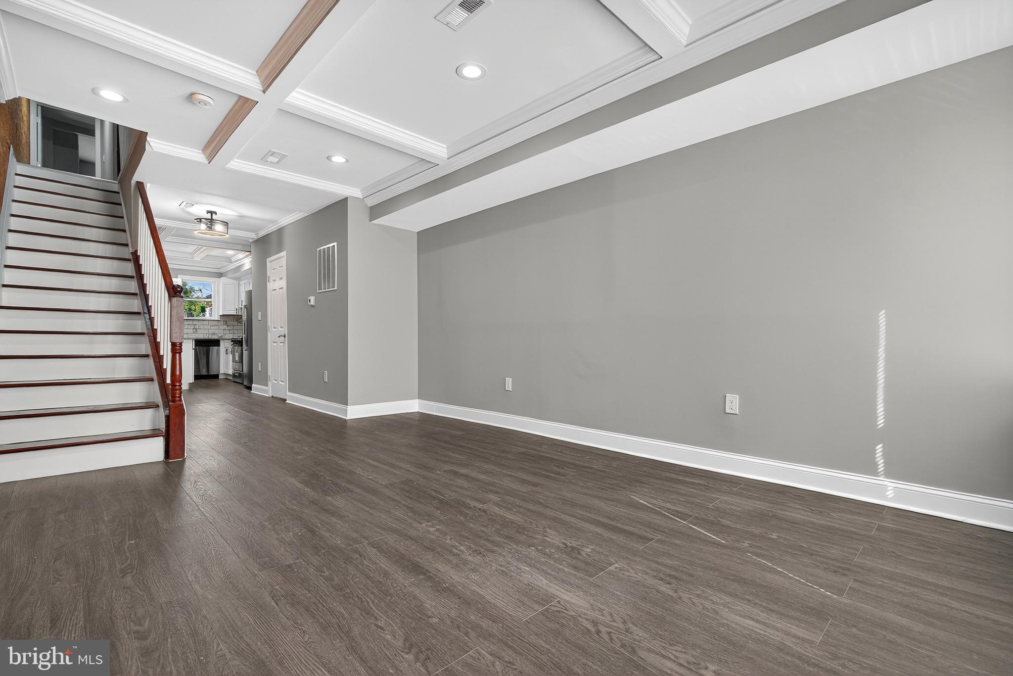 320 South Pulaski Street Baltimore, MD 21223 - Photo 9 of 46 a view of an empty room with wooden floor