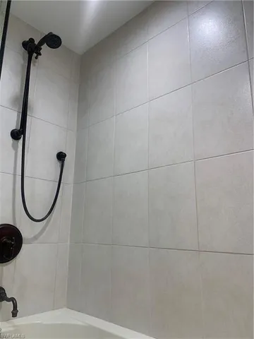 a dining room with furniture and chandelier