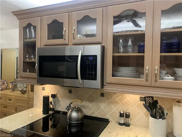 a kitchen with a sink and a stove