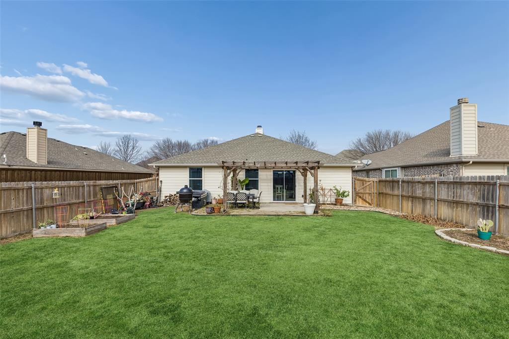 506 Austin Lane Lavon, TX 75166 - Photo 21 of 24 a front view of a house with a yard and sitting area