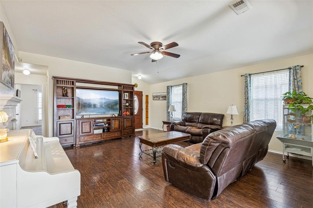 506 Austin Lane Lavon, TX 75166 - Photo 7 of 24 a living room with furniture flat screen tv and wooden floor