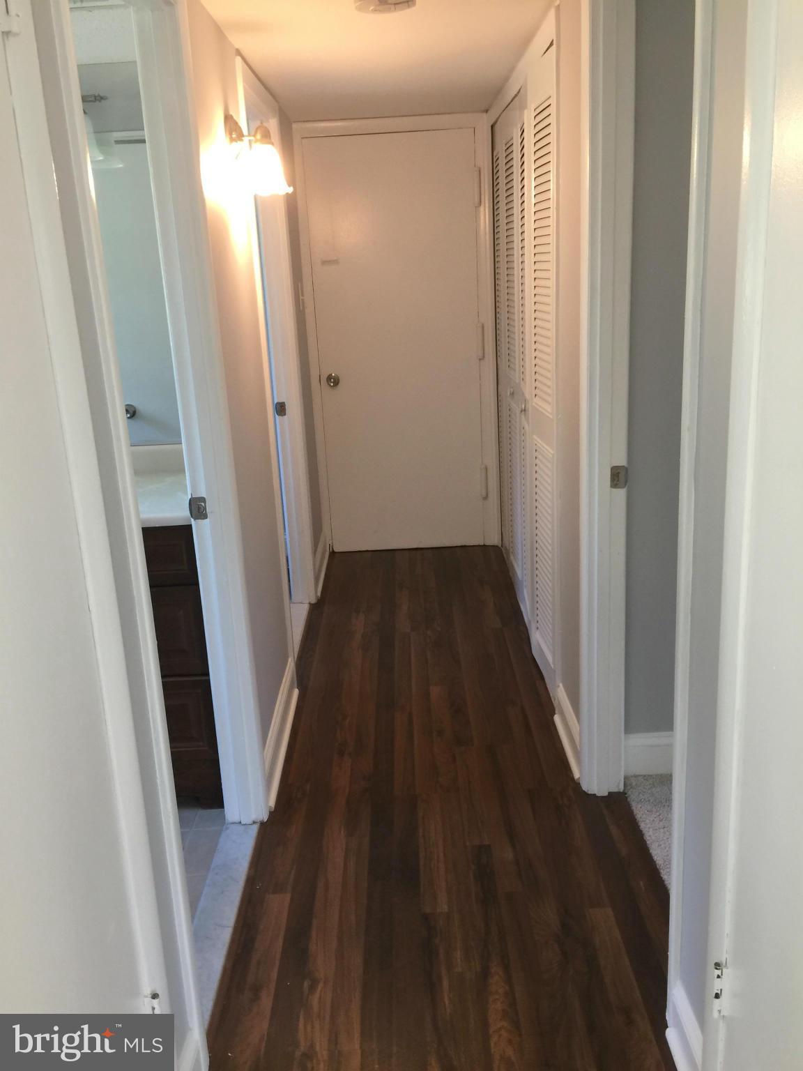 5146 Downwest Ride Columbia, MD 21044 - Photo 12 of 26 a view of a hallway and wooden floor