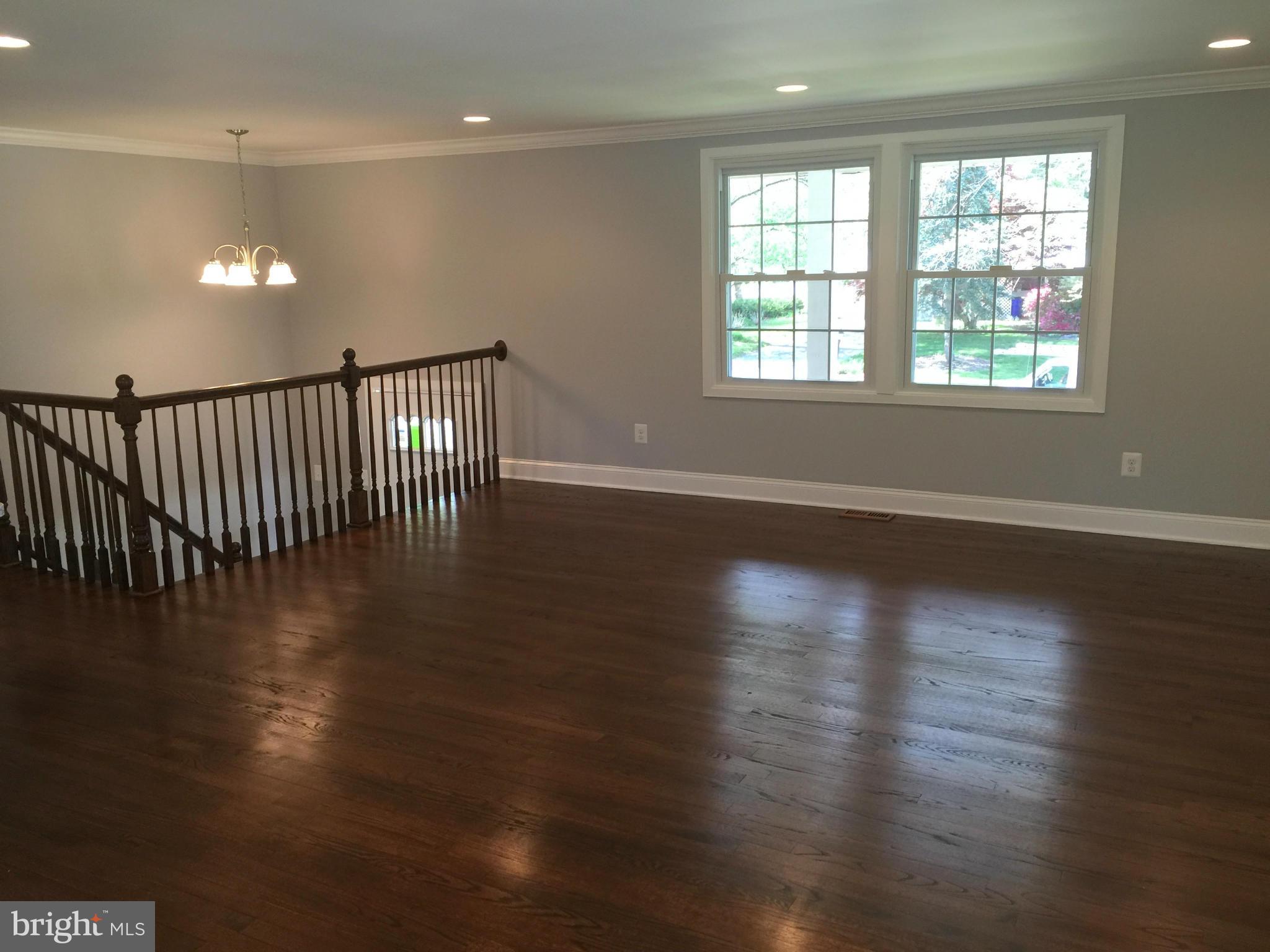 5146 Downwest Ride Columbia, MD 21044 - Photo 2 of 26 an empty room with wooden floor and windows