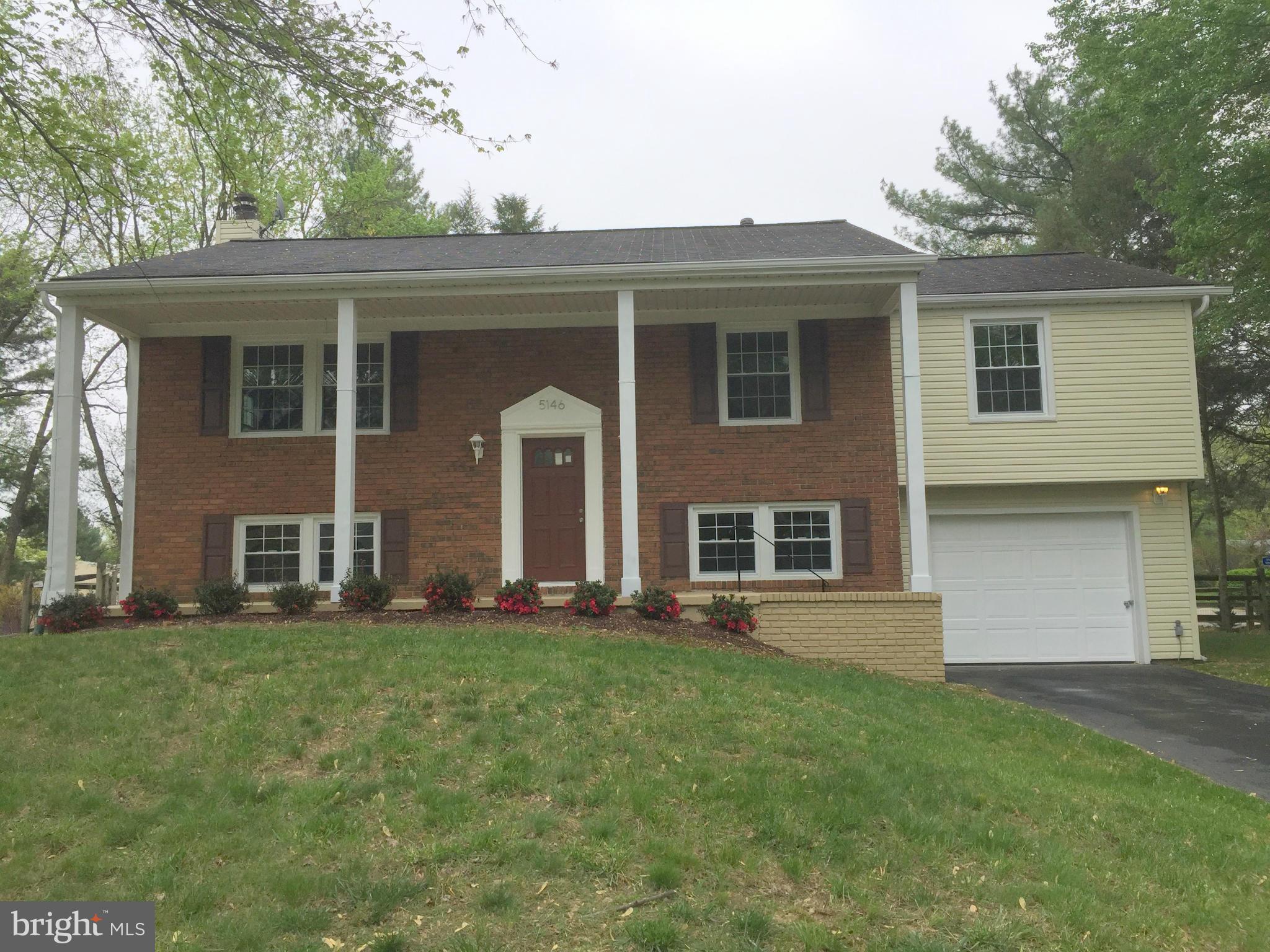 5146 Downwest Ride Columbia, MD 21044 - Photo 3 of 26 a front view of house with yard