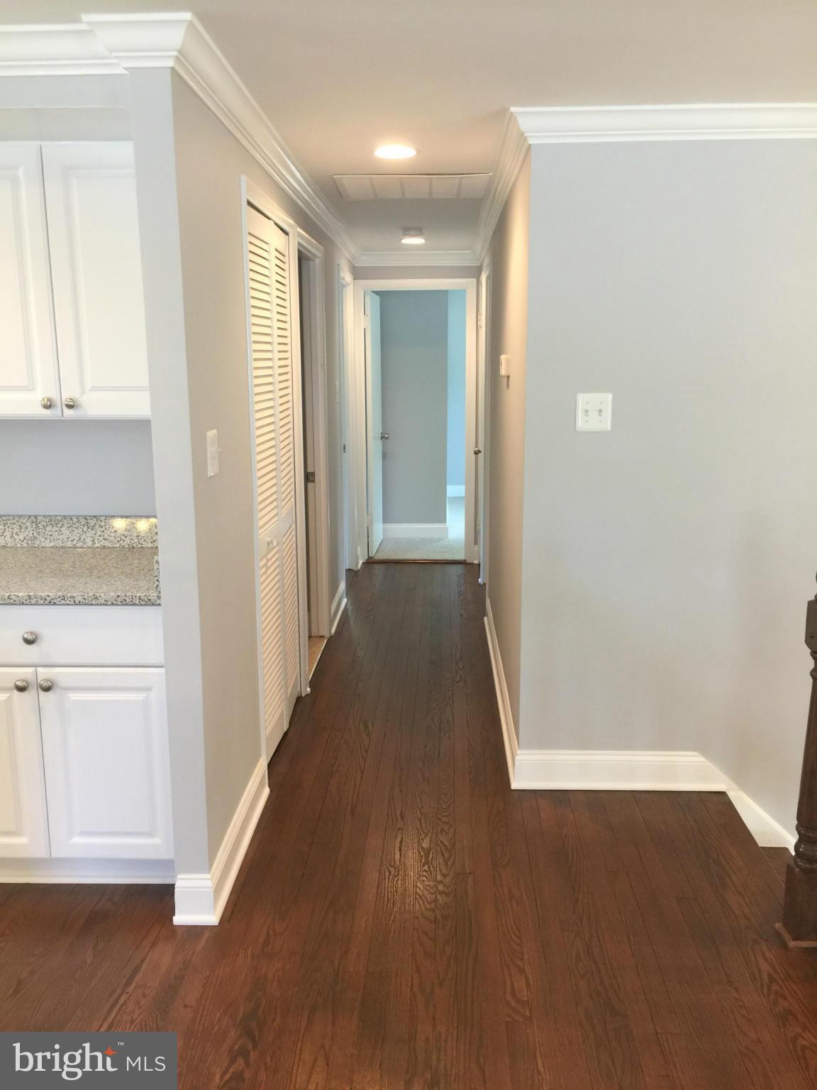 5146 Downwest Ride Columbia, MD 21044 - Photo 6 of 26 a view of a hallway with wooden floor