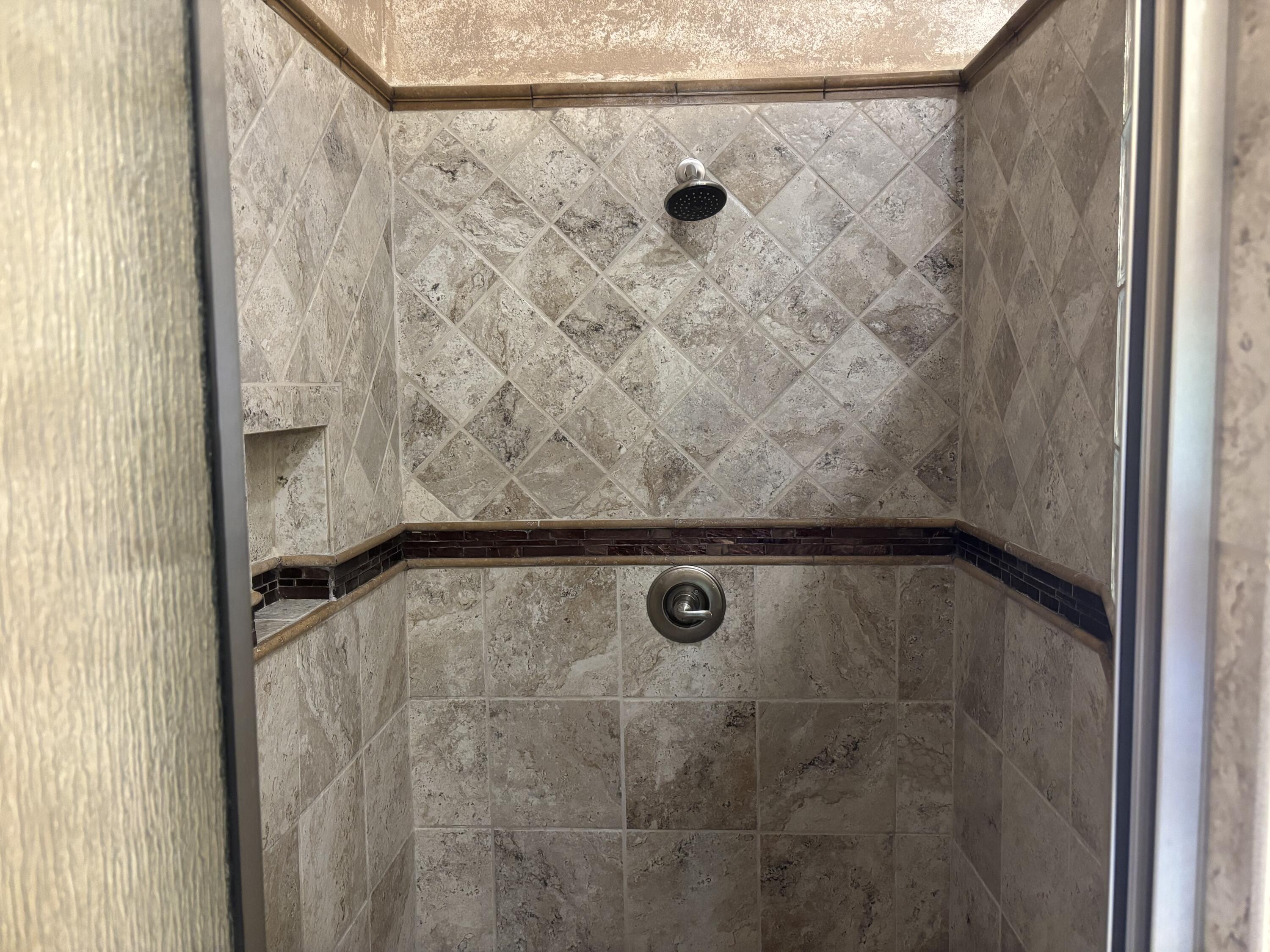 33 West Lakeshore Drive Ransom Canyon, TX 79366 - Photo 32 of 48 a bathroom with a shower