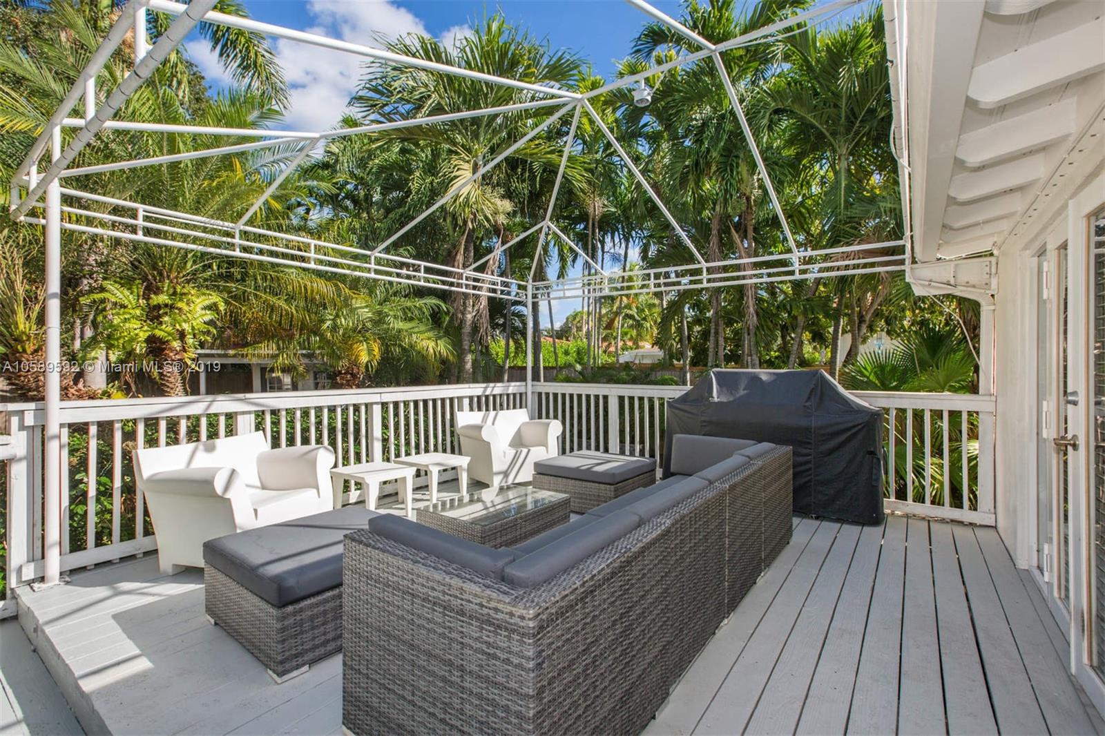 131 Southwest 23rd Road Miami, FL 33129 - Photo 15 of 20 a view of a roof deck with couches