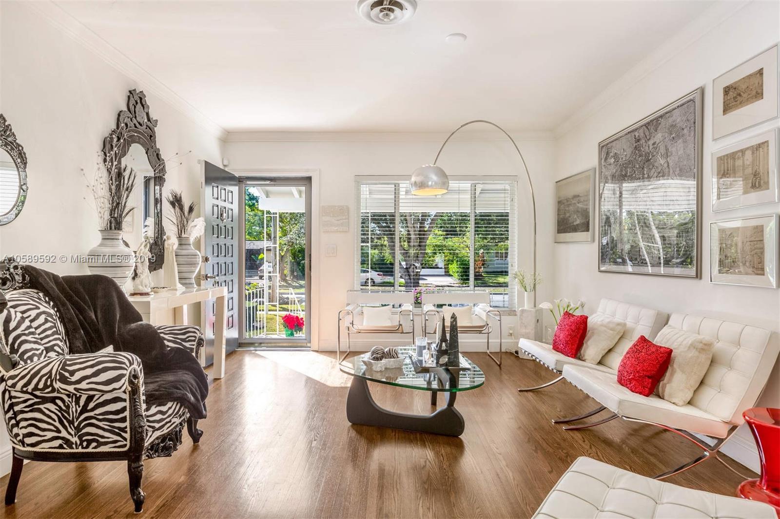 131 Southwest 23rd Road Miami, FL 33129 - Photo 2 of 20 a living room with furniture and a large window