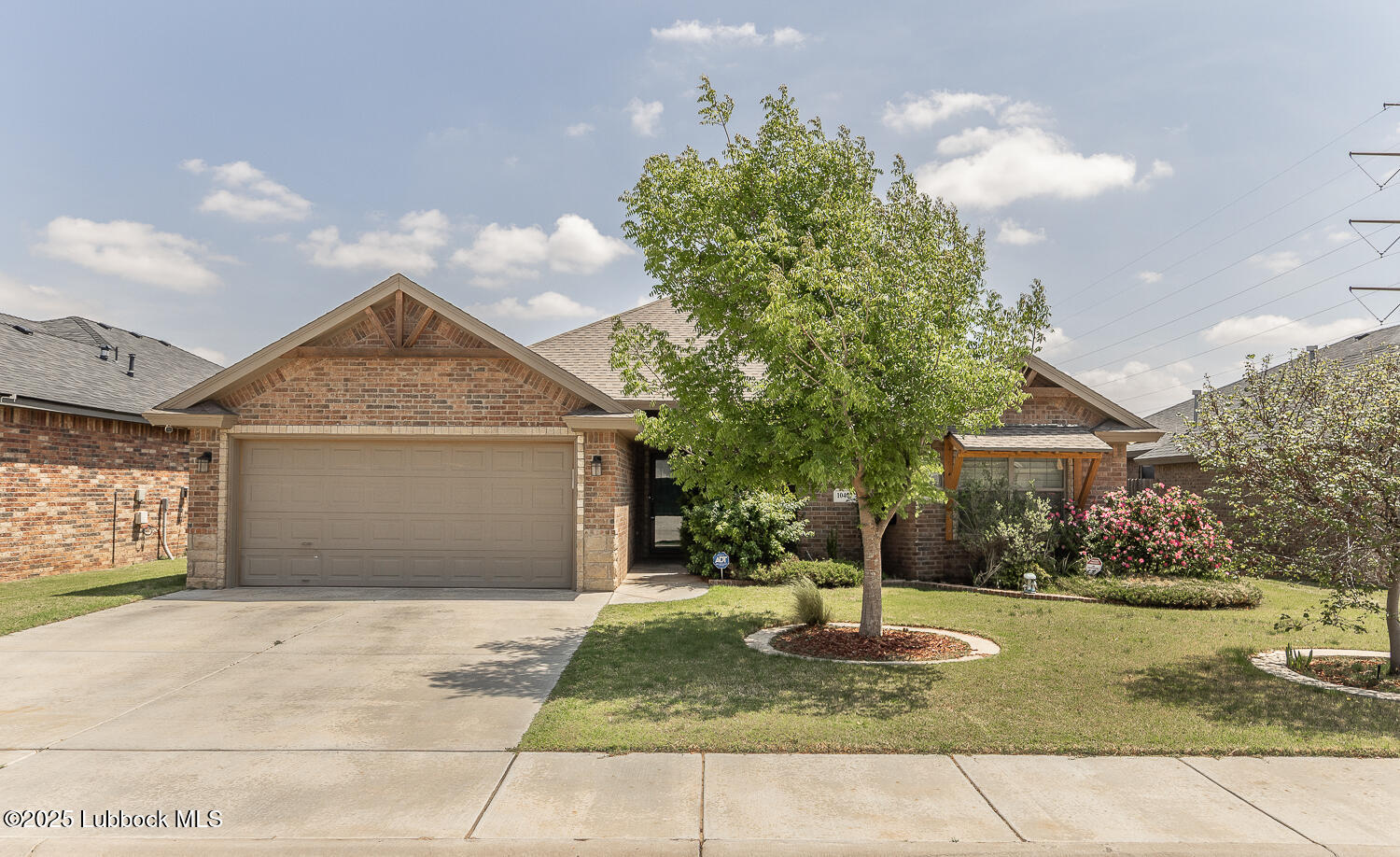 10403 Ironton Avenue Lubbock, TX 79424 - Photo 1 of 1 a front view of a house with garden