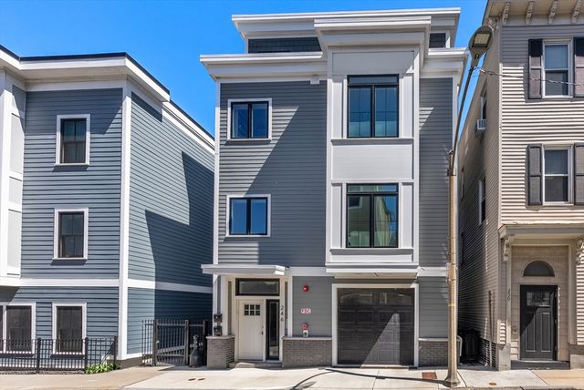 a front view of a building with many windows