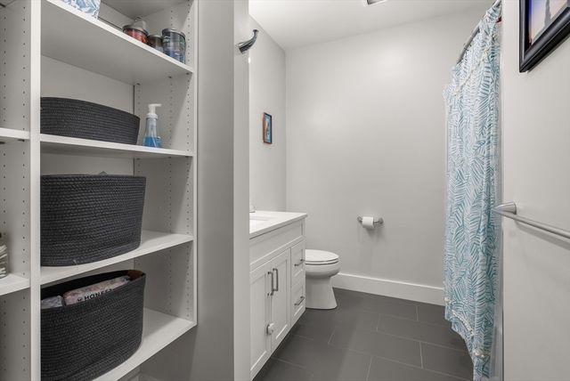 a bathroom with a toilet and a sink