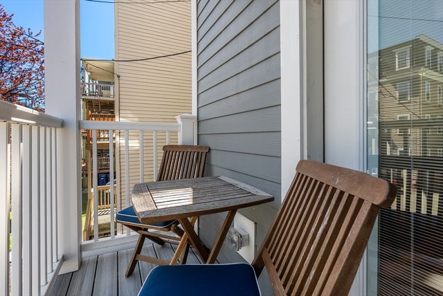 a view of balcony and wooden floor