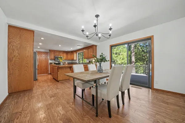a aerial view of residential houses with outdoor space and trees