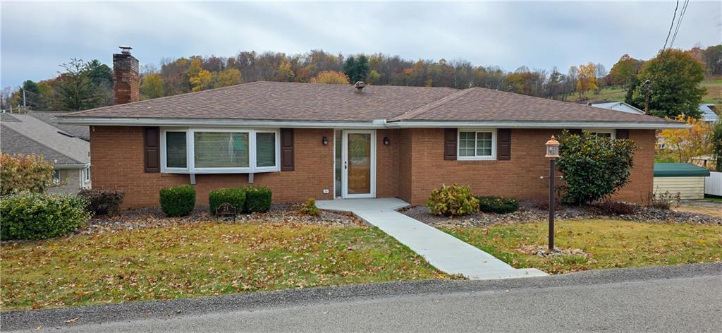 front view of a house with a yard