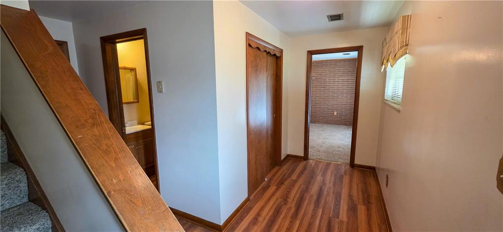 21 Stella Street Burgettstown, PA 15021 - Photo 16 of 20 a view of hallway with wooden floor and stairs