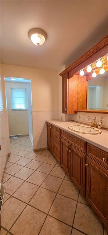 21 Stella Street Burgettstown, PA 15021 - Photo 8 of 20 a spacious bathroom with a granite countertop sink and a mirror