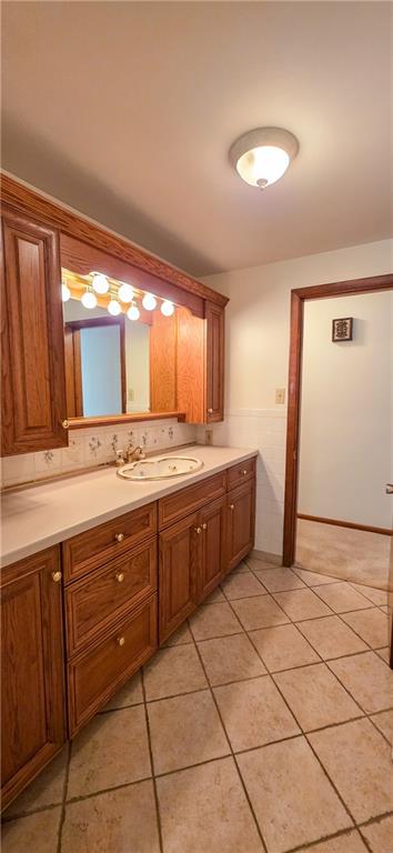 21 Stella Street Burgettstown, PA 15021 - Photo 9 of 20 a spacious bathroom with a granite countertop sink and a mirror